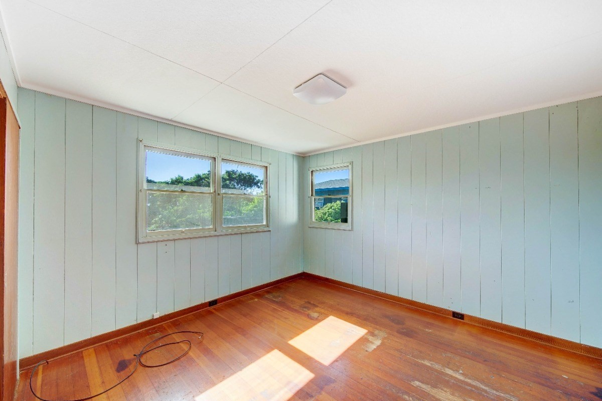 4733 Uliuli Road Eleele, HI 96705 - Photo 10 of 25 a view of a room with wooden floor and window