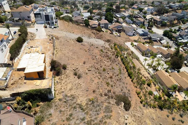 an aerial view of a residential apartment building with yard