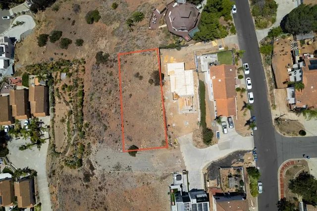 an aerial view of a backyard with parking space and parking space