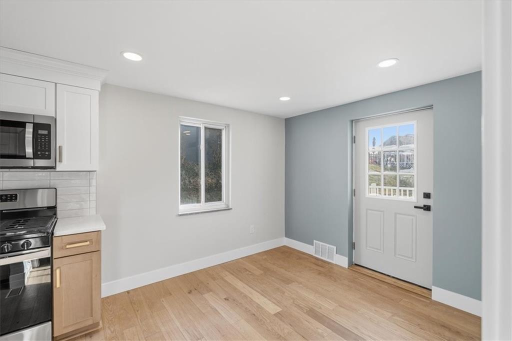 44 Ruthfred Drive Pittsburgh, PA 15241 - Photo 11 of 29 a view of a kitchen with wooden floor and electronic appliances