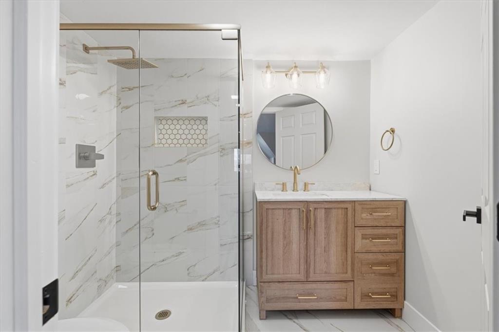 44 Ruthfred Drive Pittsburgh, PA 15241 - Photo 27 of 29 a bathroom with a shower a mirror and a sink