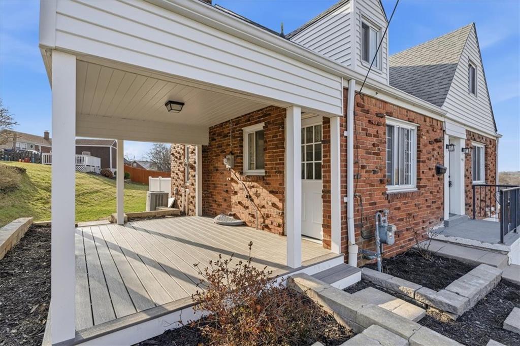 44 Ruthfred Drive Pittsburgh, PA 15241 - Photo 3 of 29 a view of backyard with large window and wooden fence
