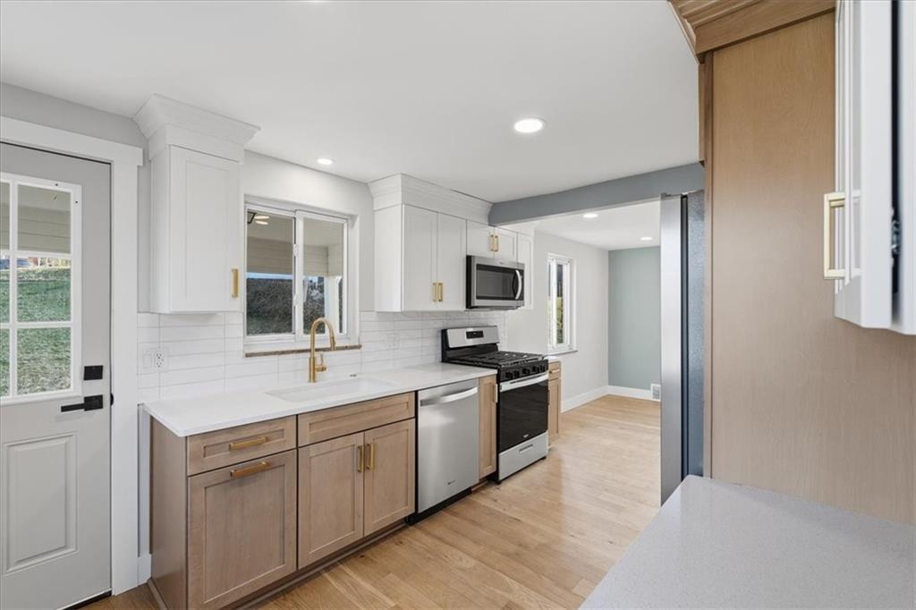 44 Ruthfred Drive Pittsburgh, PA 15241 - Photo 8 of 29 a kitchen with stainless steel appliances granite countertop a sink and stove top oven