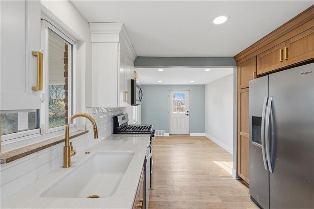 44 Ruthfred Drive Pittsburgh, PA 15241 - Photo 9 of 29 a kitchen with granite countertop a refrigerator and a sink