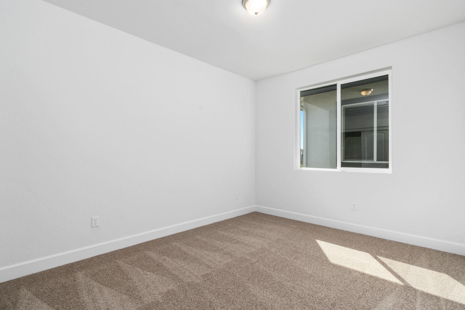 321 Peters Road Madera, CA 93636 - Photo 12 of 33 an empty room with a window