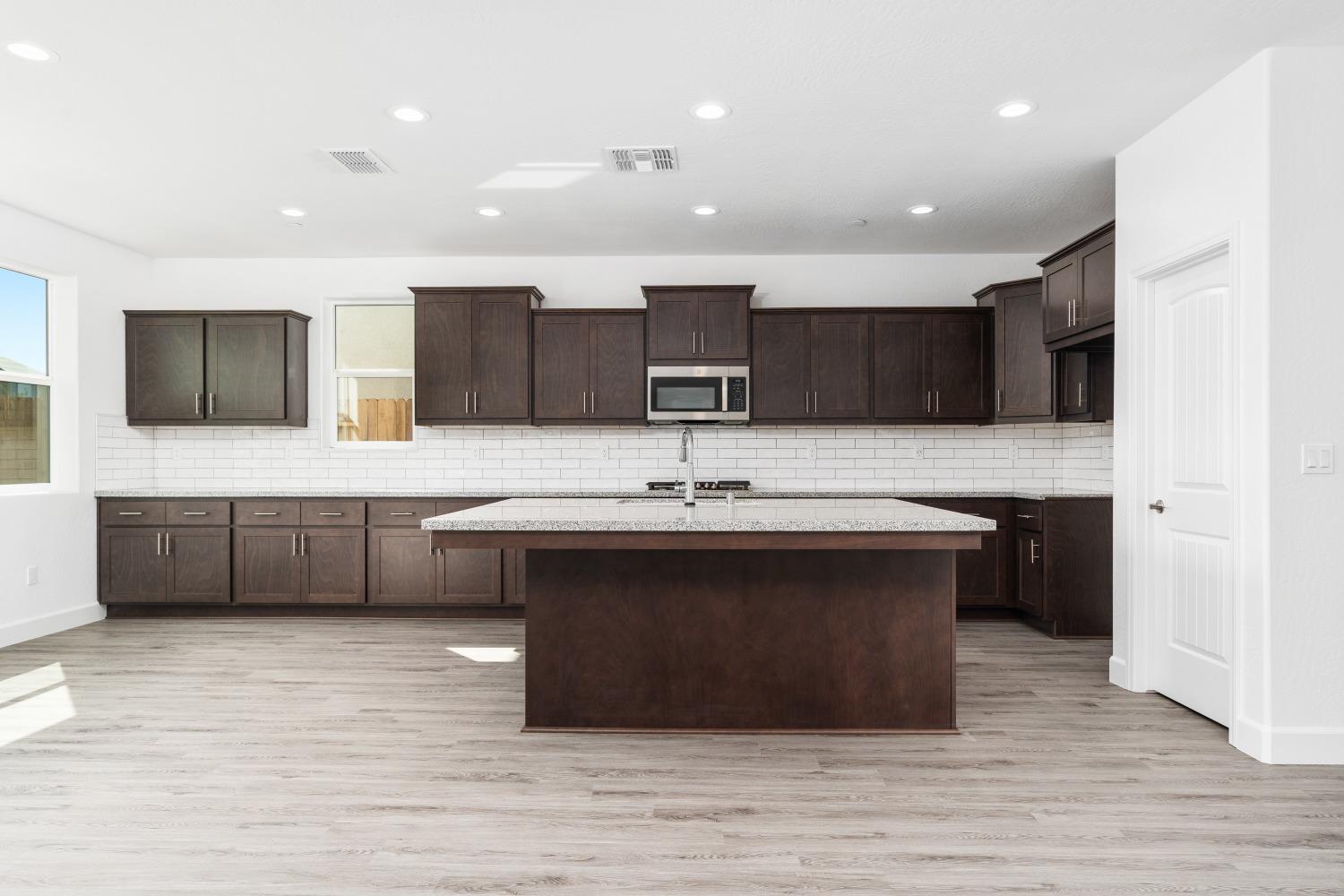 321 Peters Road Madera, CA 93636 - Photo 21 of 33 a kitchen with a sink and cabinets
