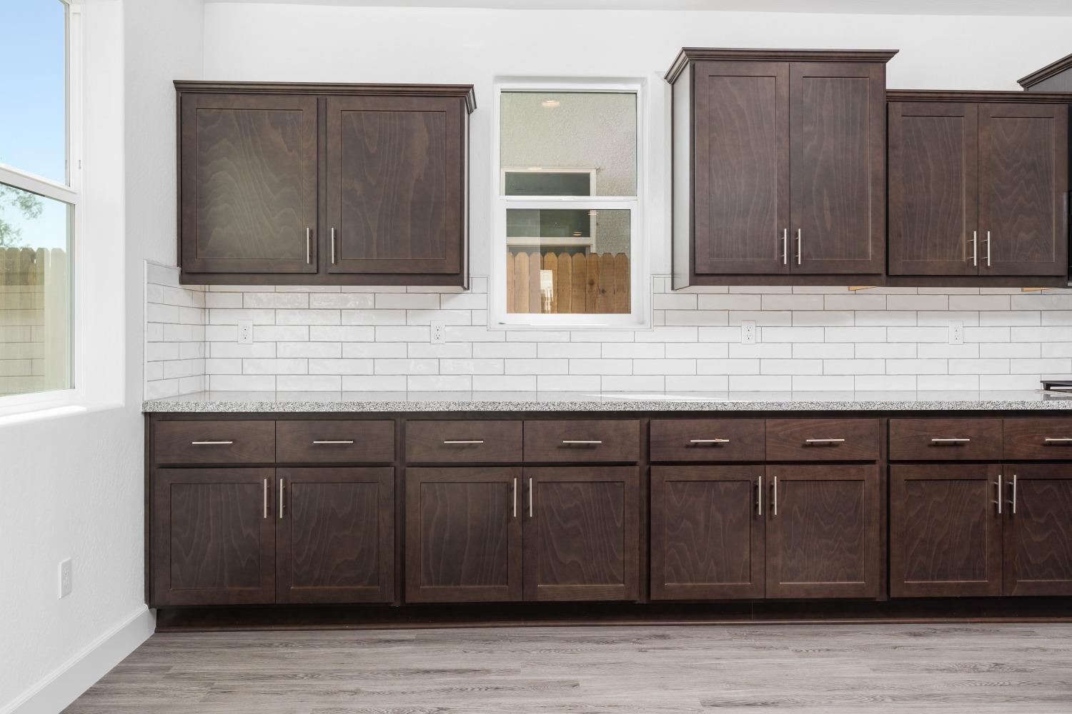 321 Peters Road Madera, CA 93636 - Photo 25 of 33 a kitchen with wooden cabinets