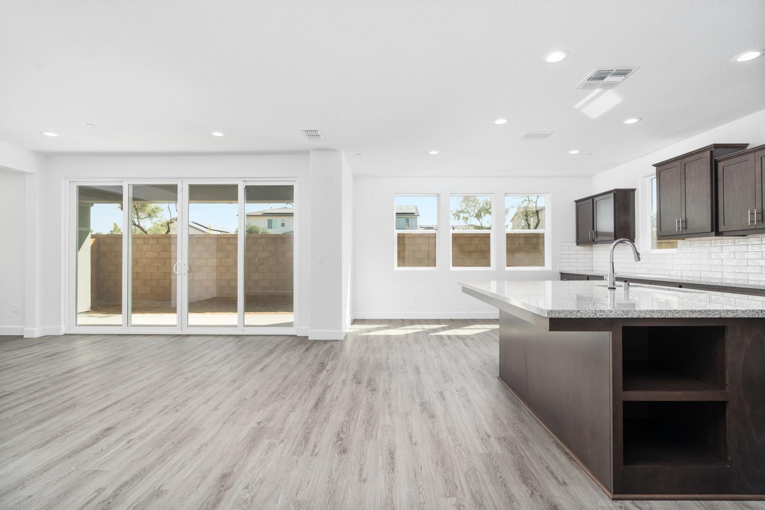 321 Peters Road Madera, CA 93636 - Photo 29 of 33 a view of an empty room with wooden floor and a window