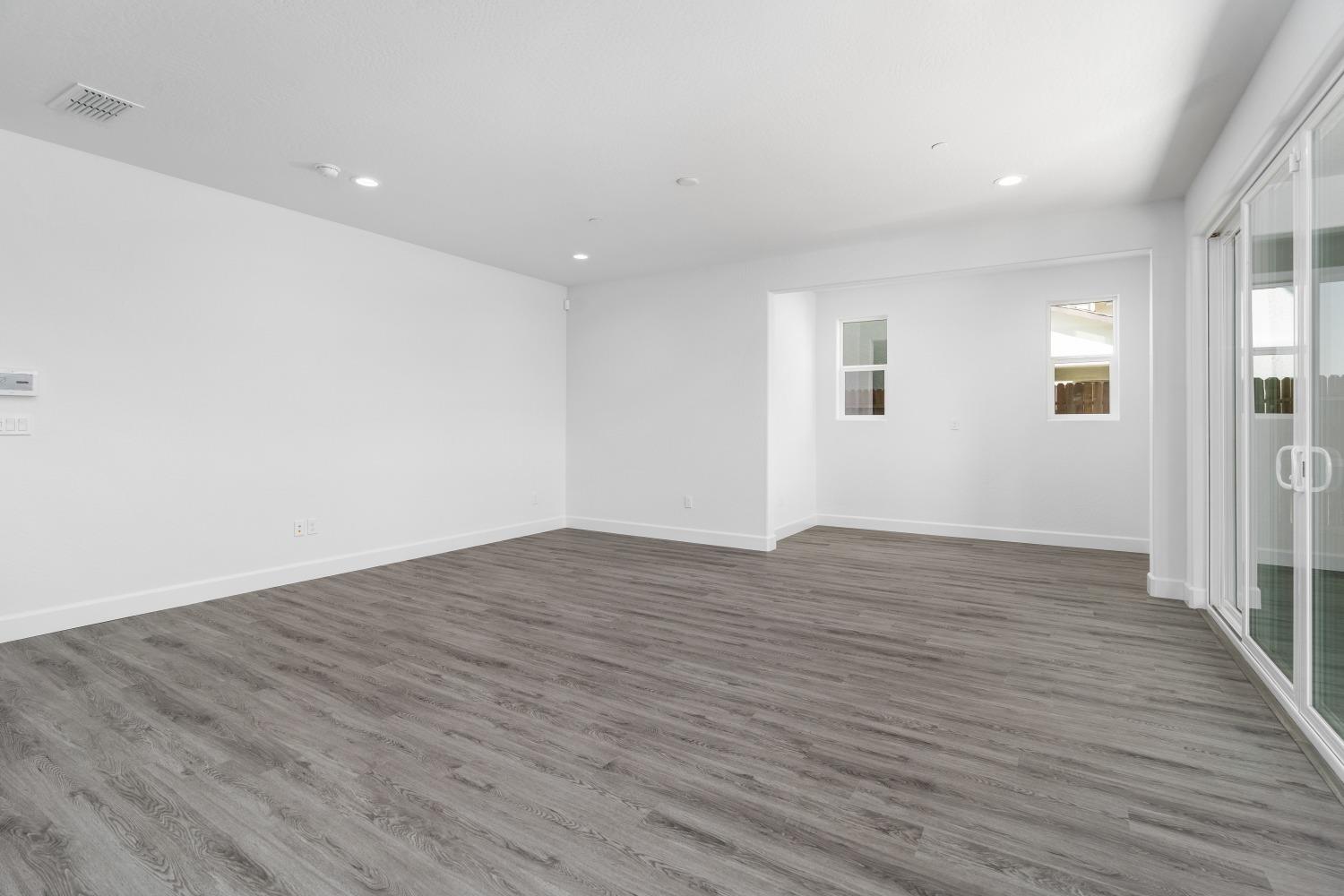 321 Peters Road Madera, CA 93636 - Photo 30 of 33 wooden floor in an empty room with a window