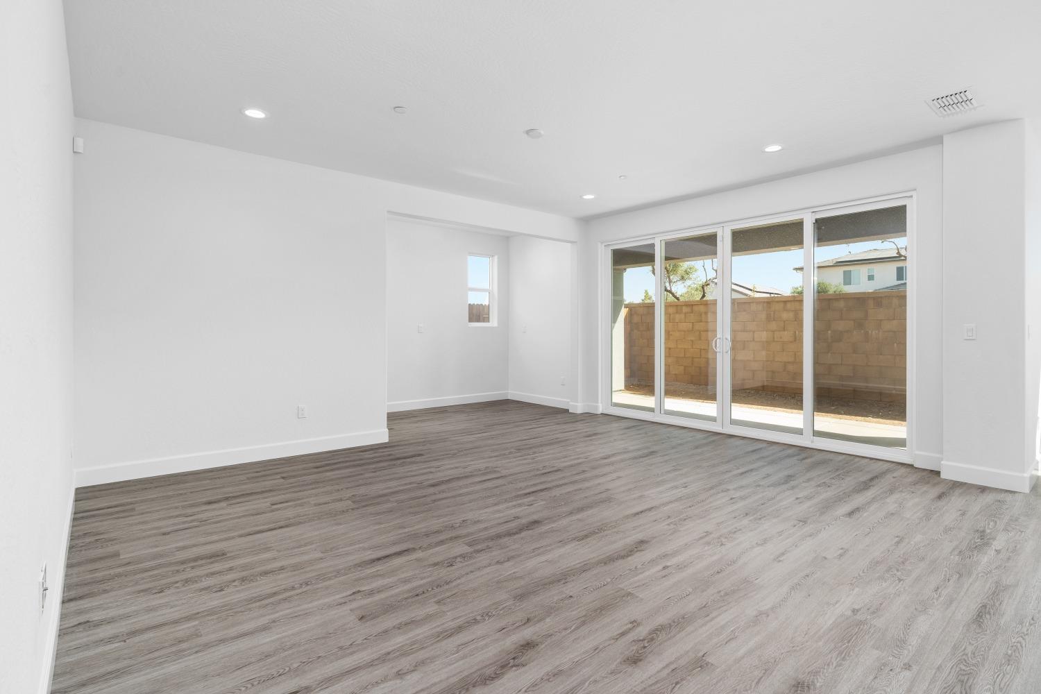 321 Peters Road Madera, CA 93636 - Photo 31 of 33 a view of an empty room with wooden floor and a window