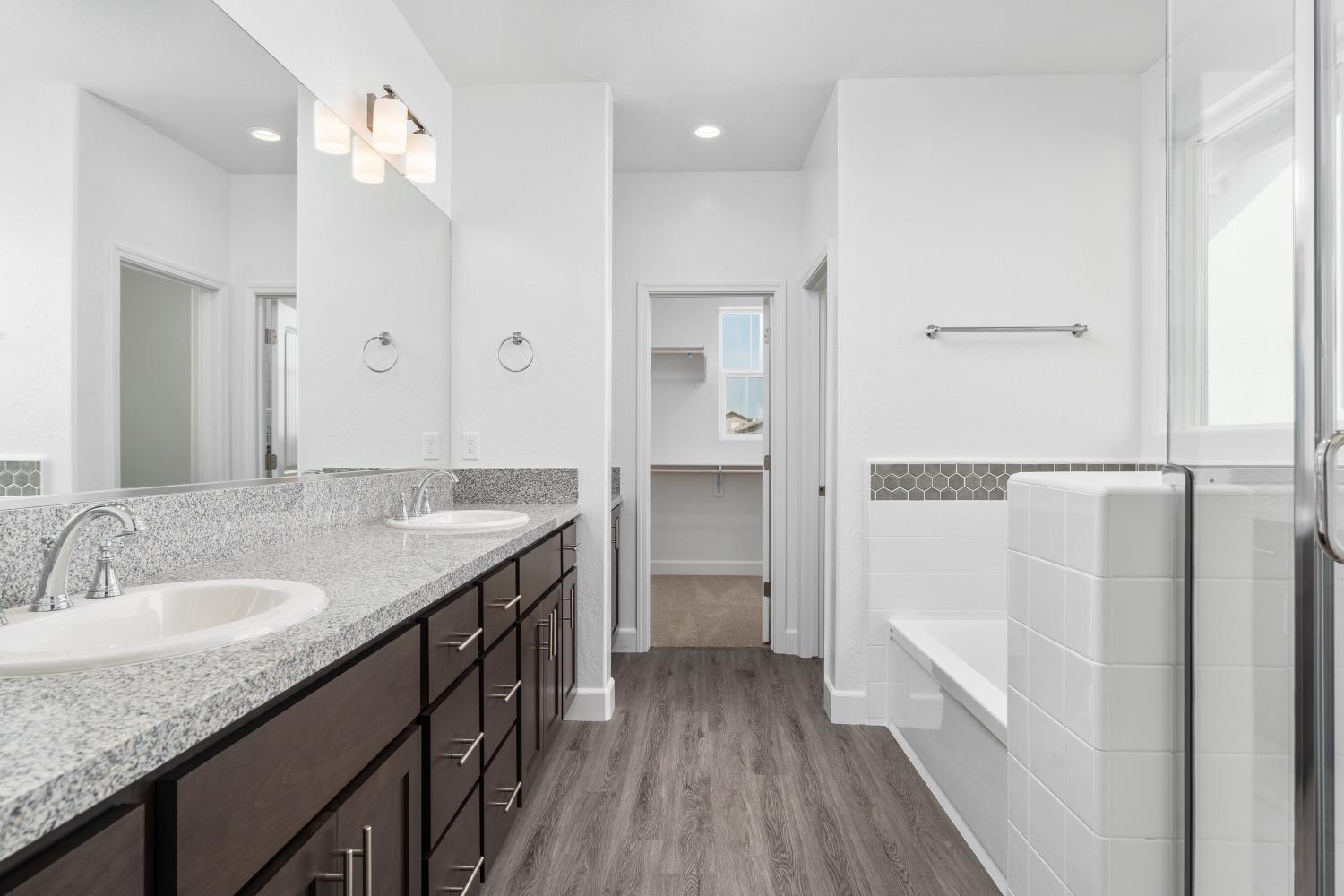 321 Peters Road Madera, CA 93636 - Photo 10 of 33 a bathroom with a granite countertop sink a toilet a shower and a mirror