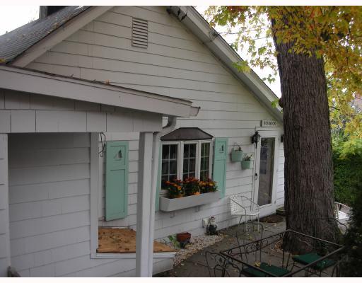 Undisclosed Address Rowayton, CT 06853 - Photo 4 of 10 a front view of a house with a glass door