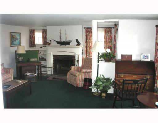 Undisclosed Address Rowayton, CT 06853 - Photo 5 of 10 a living room with furniture and a fireplace