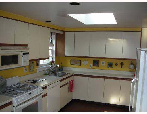Undisclosed Address Rowayton, CT 06853 - Photo 7 of 10 a kitchen with a sink a stove and cabinets