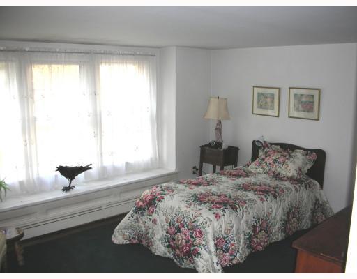 Undisclosed Address Rowayton, CT 06853 - Photo 9 of 10 a bedroom with a bed and a large window