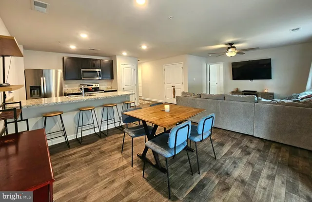 a kitchen with a table and chairs in it