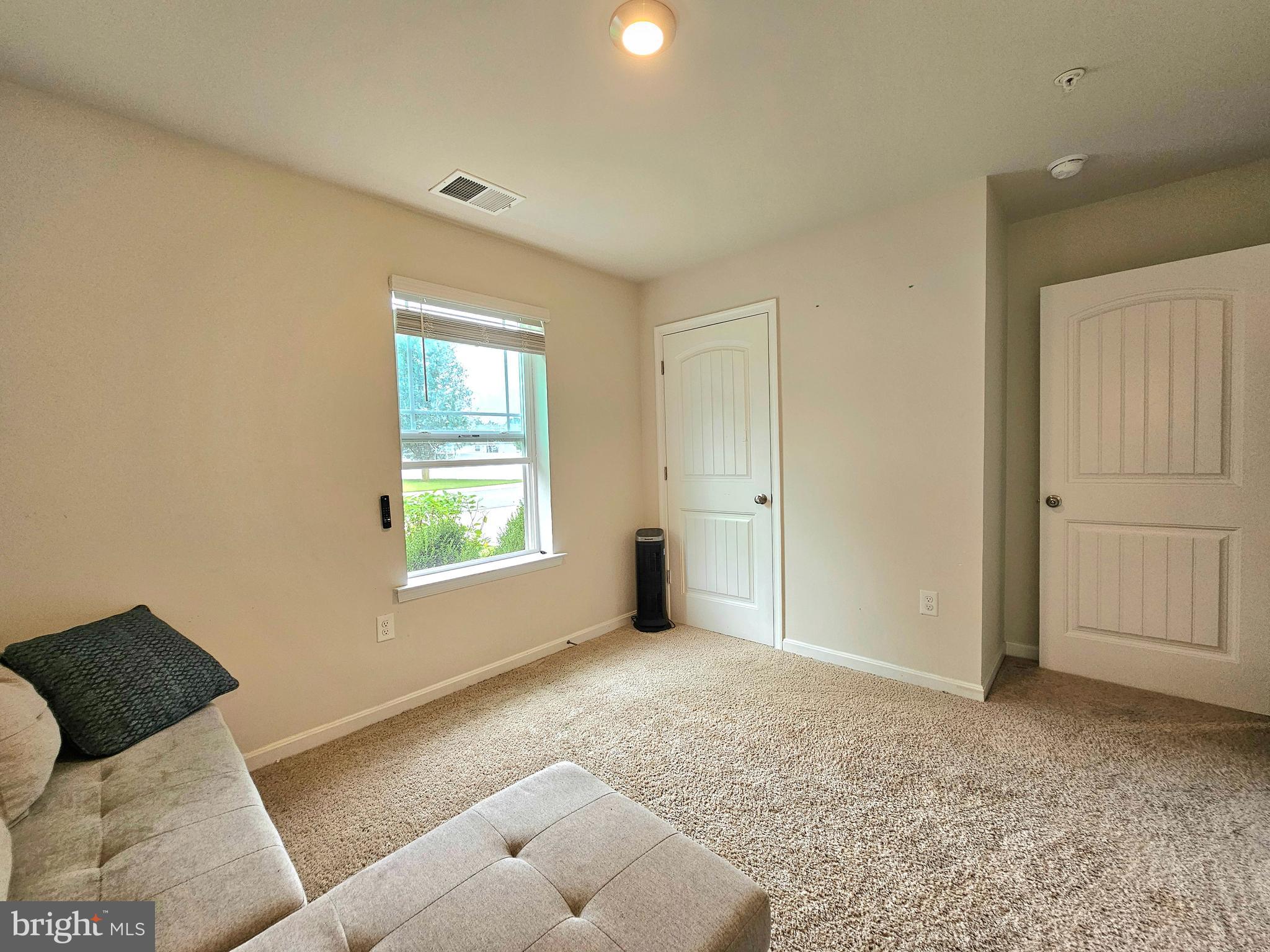 415 Creekside Trail Fruitland, MD 21826 - Photo 4 of 41 a view of livingroom with furniture and window