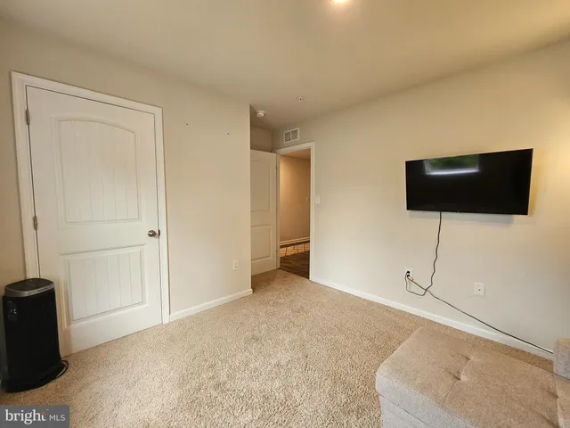 a view of a livingroom with furniture and wooden floor