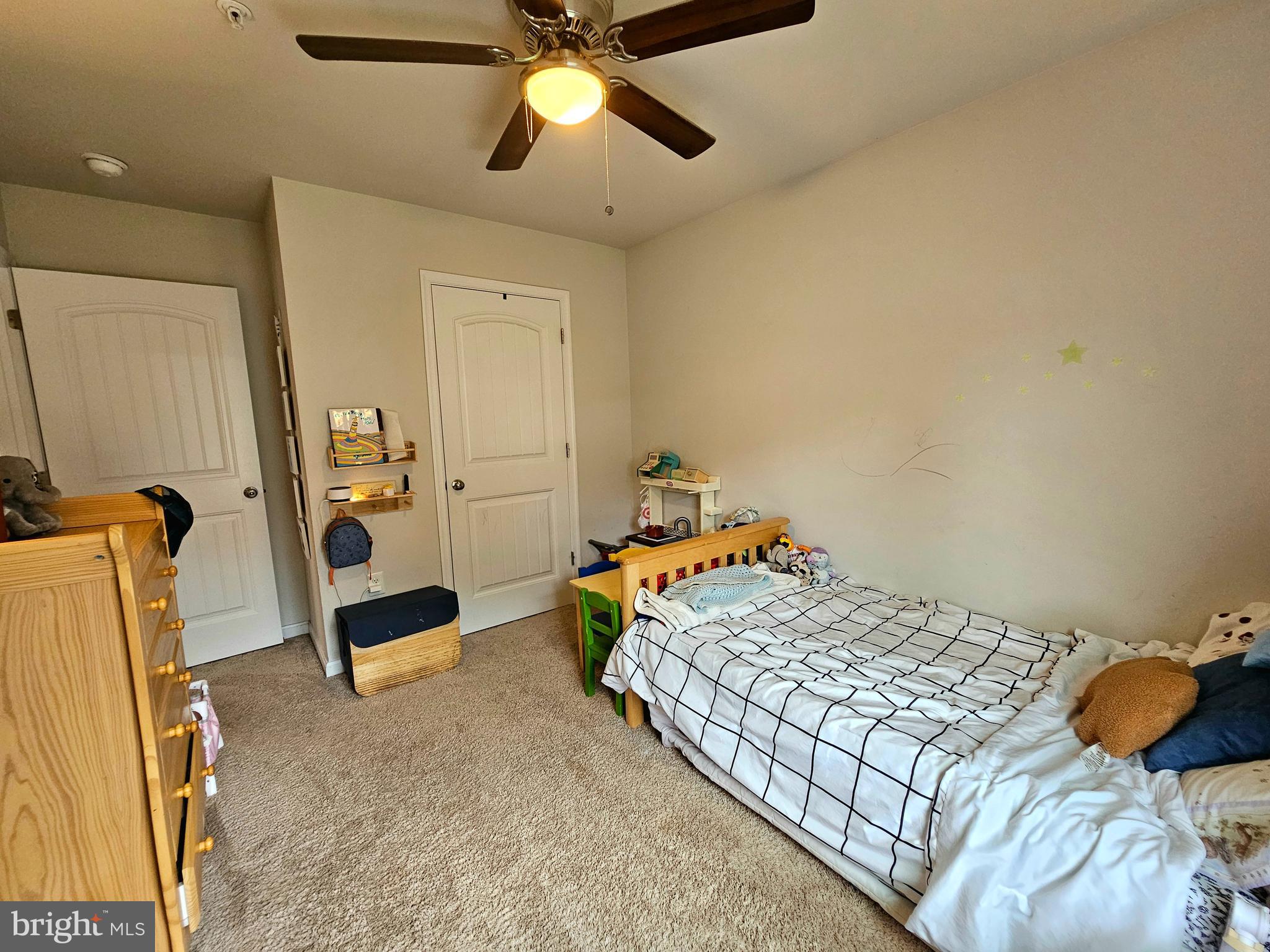 415 Creekside Trail Fruitland, MD 21826 - Photo 9 of 41 a bedroom with a bed and a chandelier