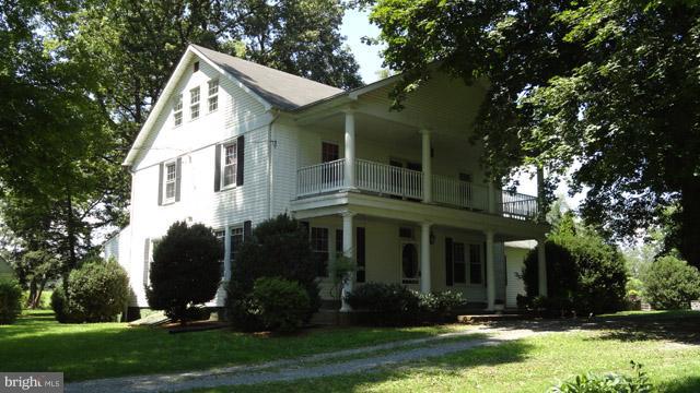 837 Leetown Road Summit Point, WV 25446 - Photo 1 of 30 front view of a house with a yard