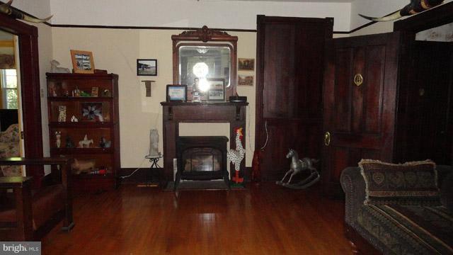 837 Leetown Road Summit Point, WV 25446 - Photo 14 of 30 a living room with furniture and a fireplace