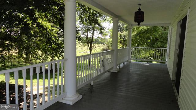837 Leetown Road Summit Point, WV 25446 - Photo 22 of 30 a view of balcony with wooden floor