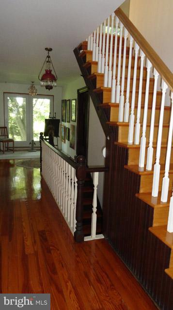 837 Leetown Road Summit Point, WV 25446 - Photo 26 of 30 a view of entryway livingroom and hall with wooden floor