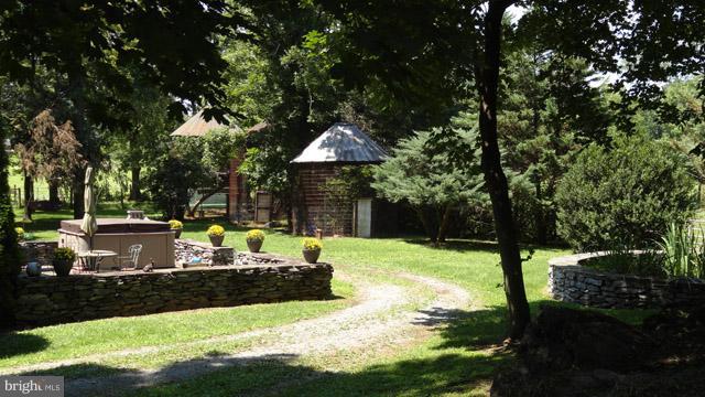 837 Leetown Road Summit Point, WV 25446 - Photo 6 of 30 a view of a house with backyard and sitting area