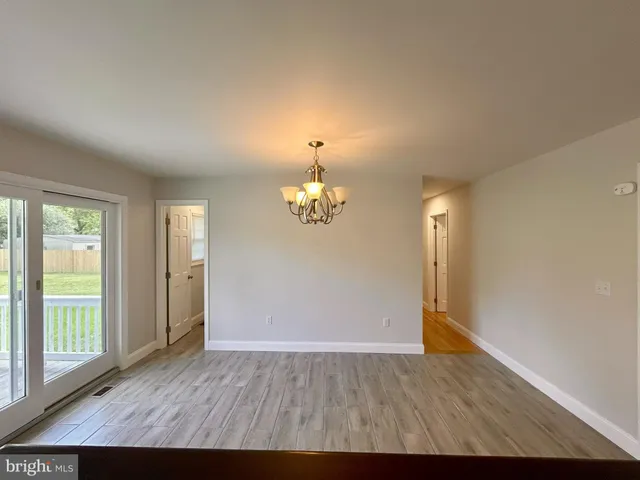 a view of deck with mountain and trees in the background