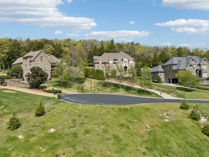 an aerial view of a house having swimming pool