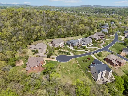 an aerial view of a house with a garden