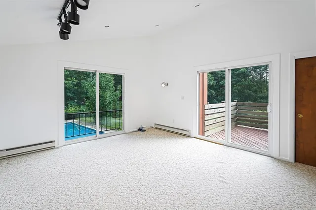 a view of empty room with floor to ceiling window