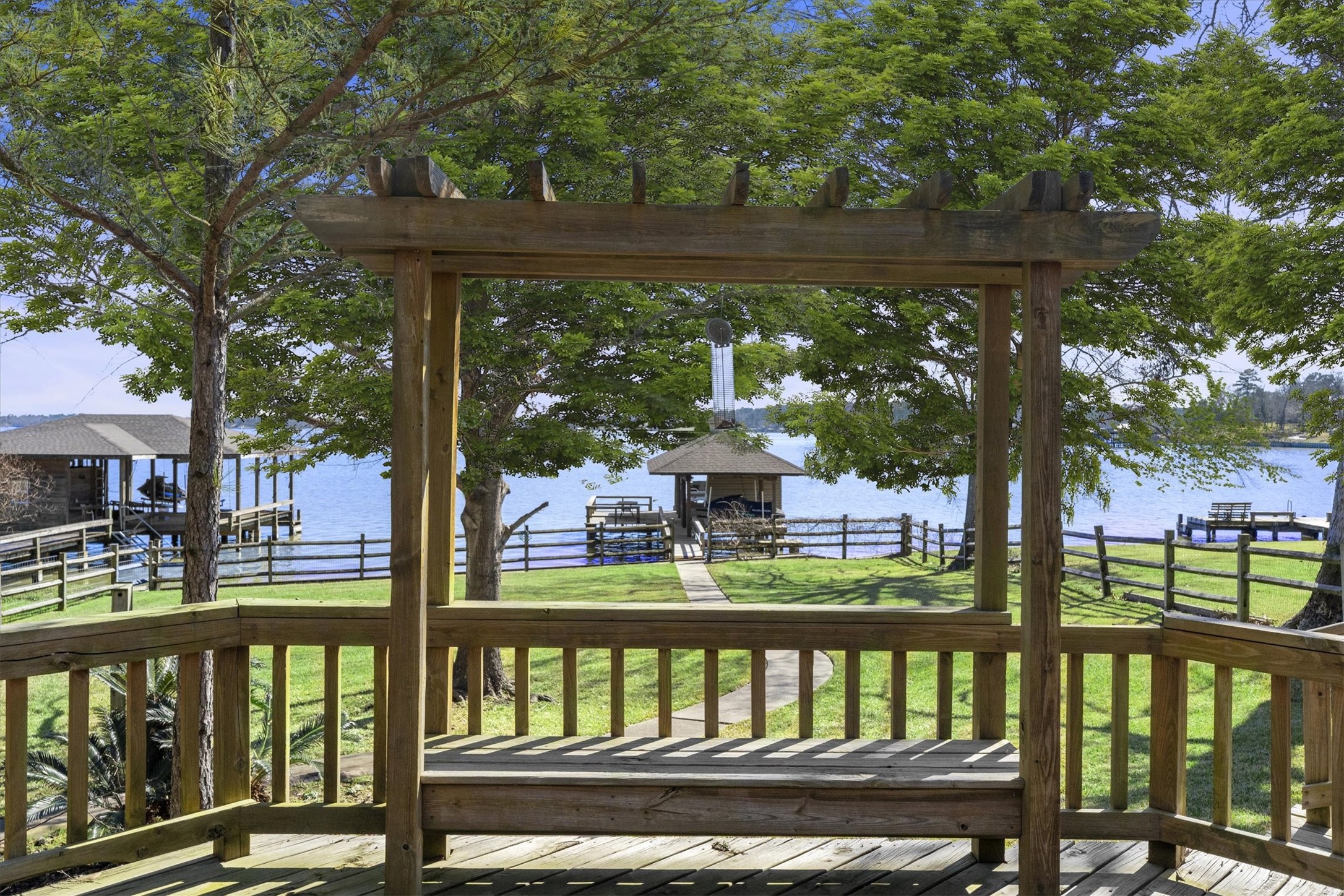 241 Harbour Point Circle Coldspring, TX 77331 - Photo 3 of 33 Expansive deck with plenty of seating options and wonderful views of the water.