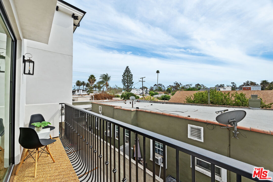 2324 South Dunsmuir Avenue, Unit 1/2 Los Angeles, CA 90016 - Photo 8 of 27 a view of a lake from a balcony