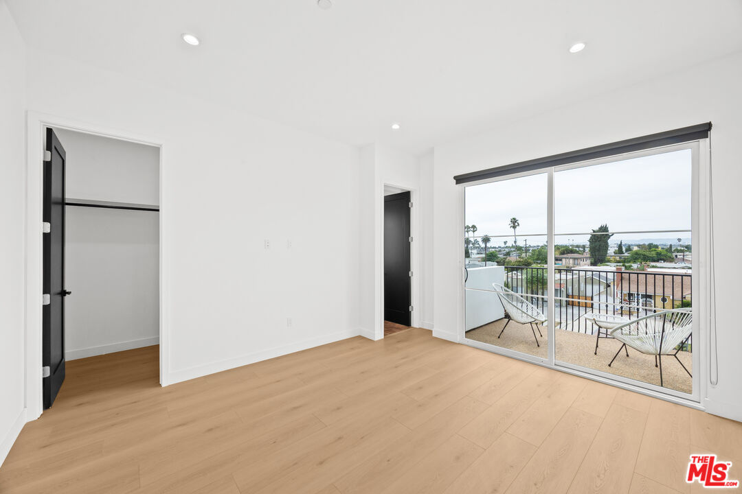 2324 South Dunsmuir Avenue, Unit 1/2 Los Angeles, CA 90016 - Photo 9 of 27 a view of a room with balcony and city view