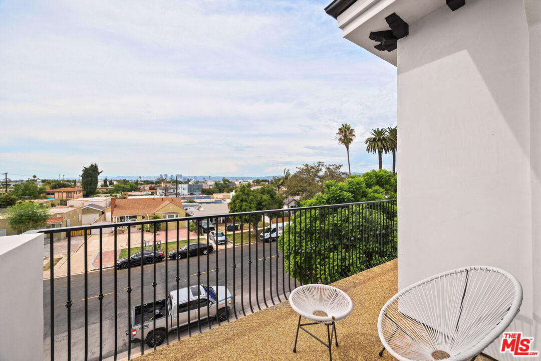 2324 South Dunsmuir Avenue, Unit 1/2 Los Angeles, CA 90016 - Photo 10 of 27 a view of a balcony with furniture
