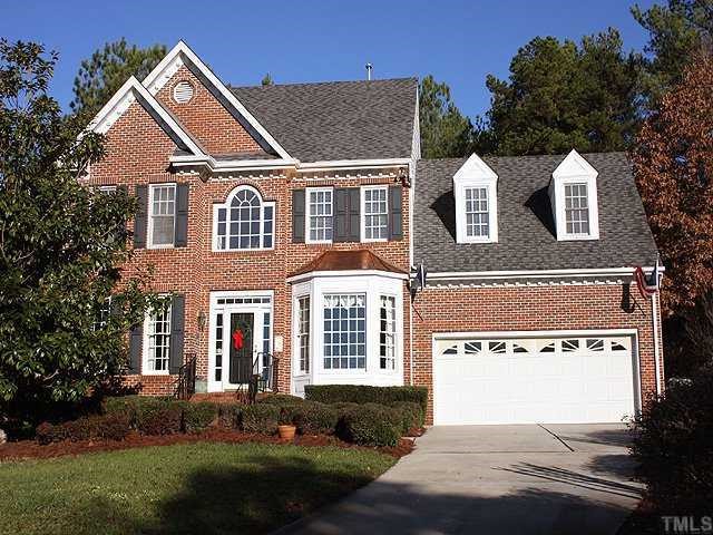 2716 Amstel Way Raleigh, NC 27613 - Photo 1 of 12 a front view of a house with a yard and garage