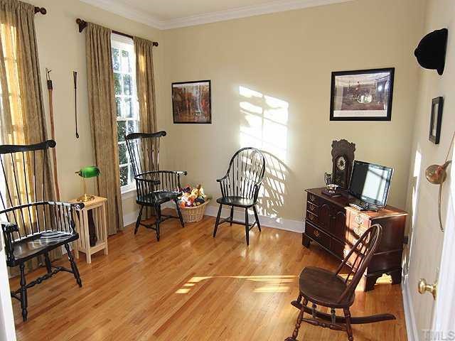 2716 Amstel Way Raleigh, NC 27613 - Photo 2 of 12 a view of a livingroom with furniture and a workspace