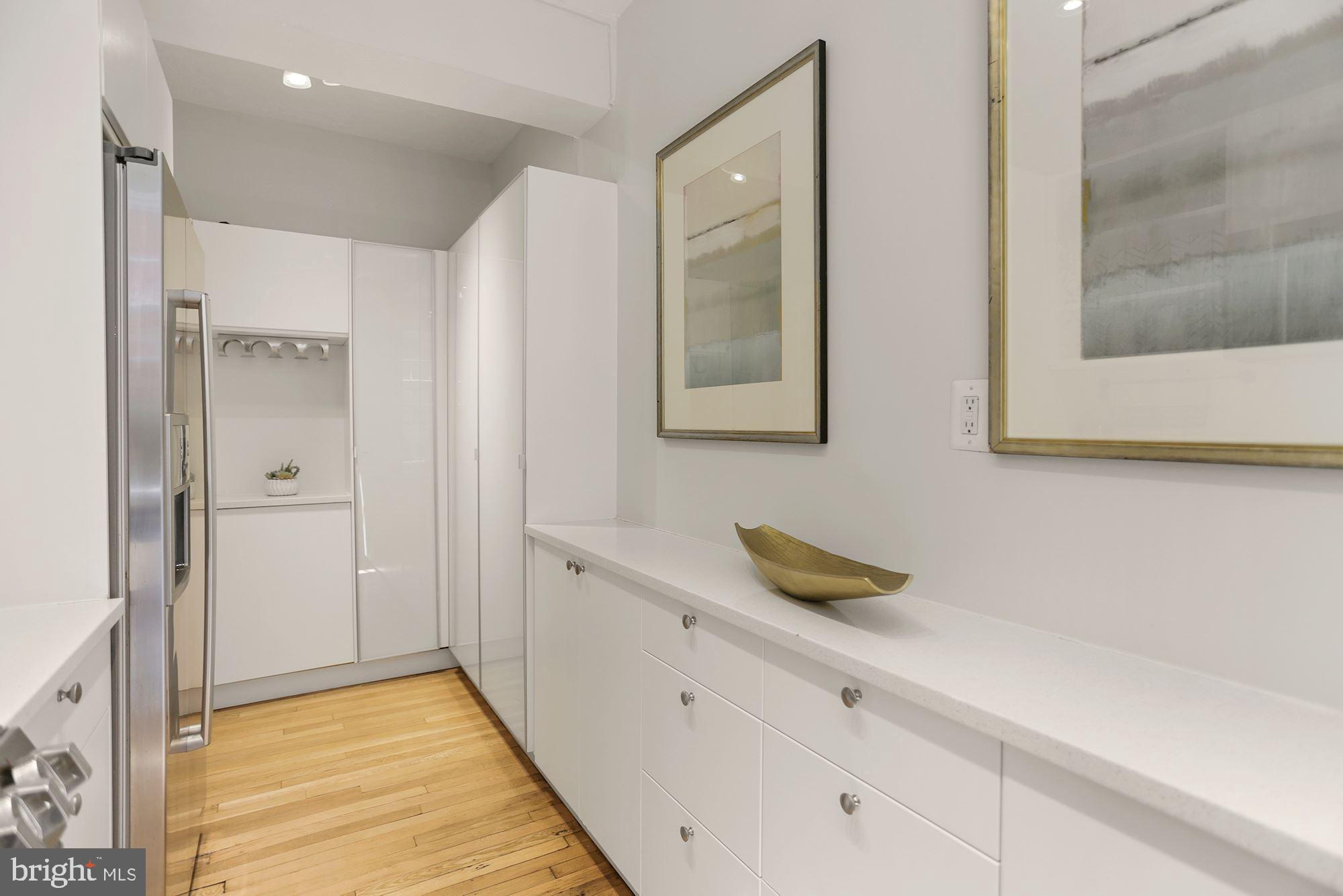 1705 Lanier Place Northwest, Unit 304 Washington, DC 20009 - Photo 13 of 35 A+ Kitchen Storage w Two Walls of Custom Built ins