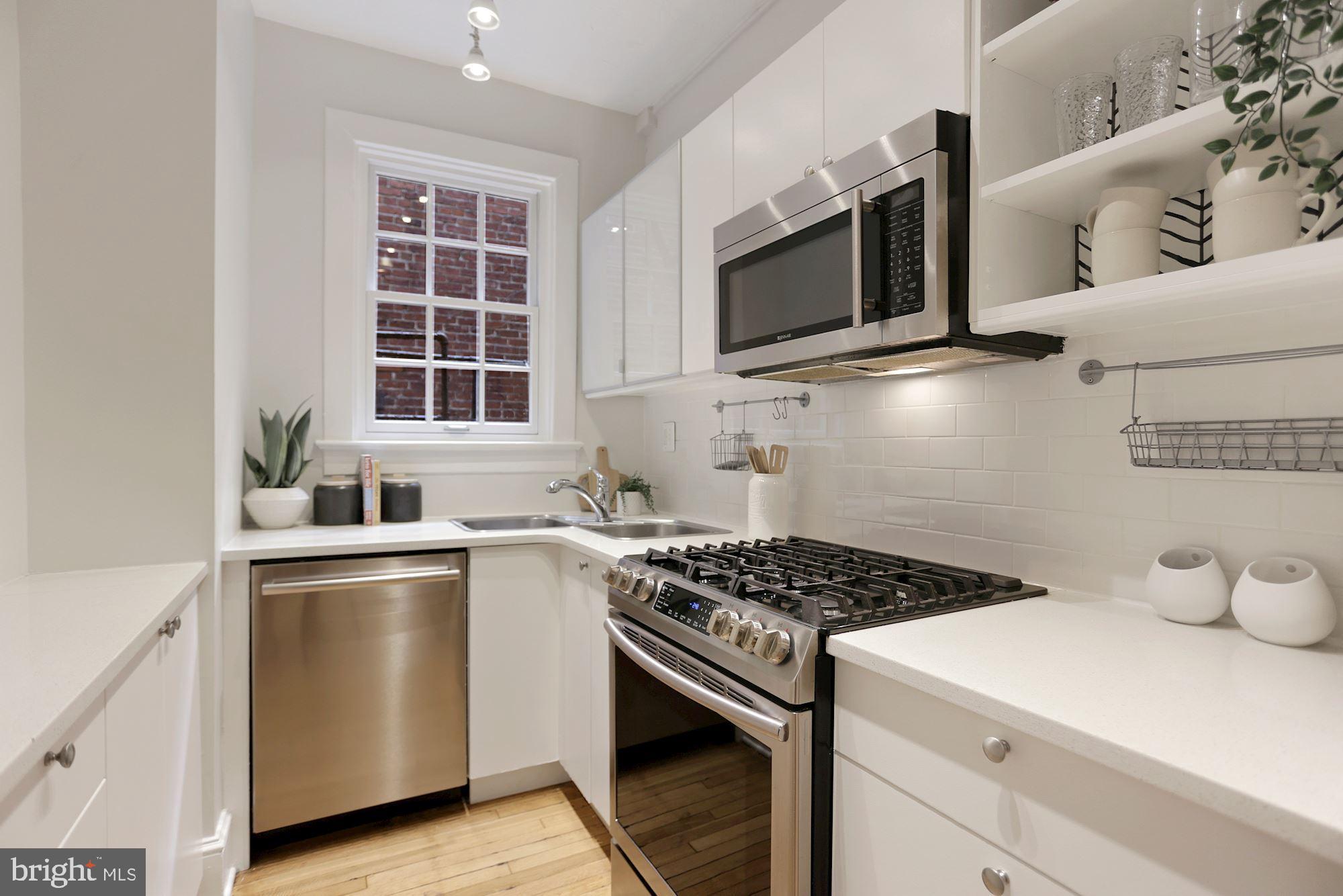 1705 Lanier Place Northwest, Unit 304 Washington, DC 20009 - Photo 14 of 35 Bosch Dishwasher Slide in Gas Range both from 2018