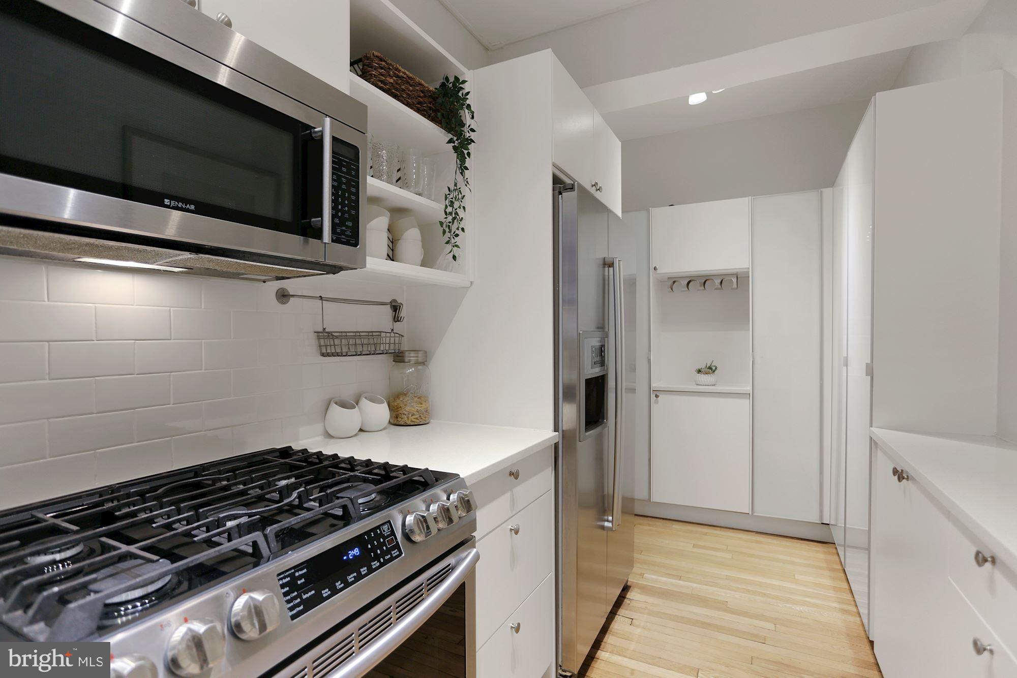 1705 Lanier Place Northwest, Unit 304 Washington, DC 20009 - Photo 15 of 35 Bosch French Door Refrigerator & Tile Backsplash
