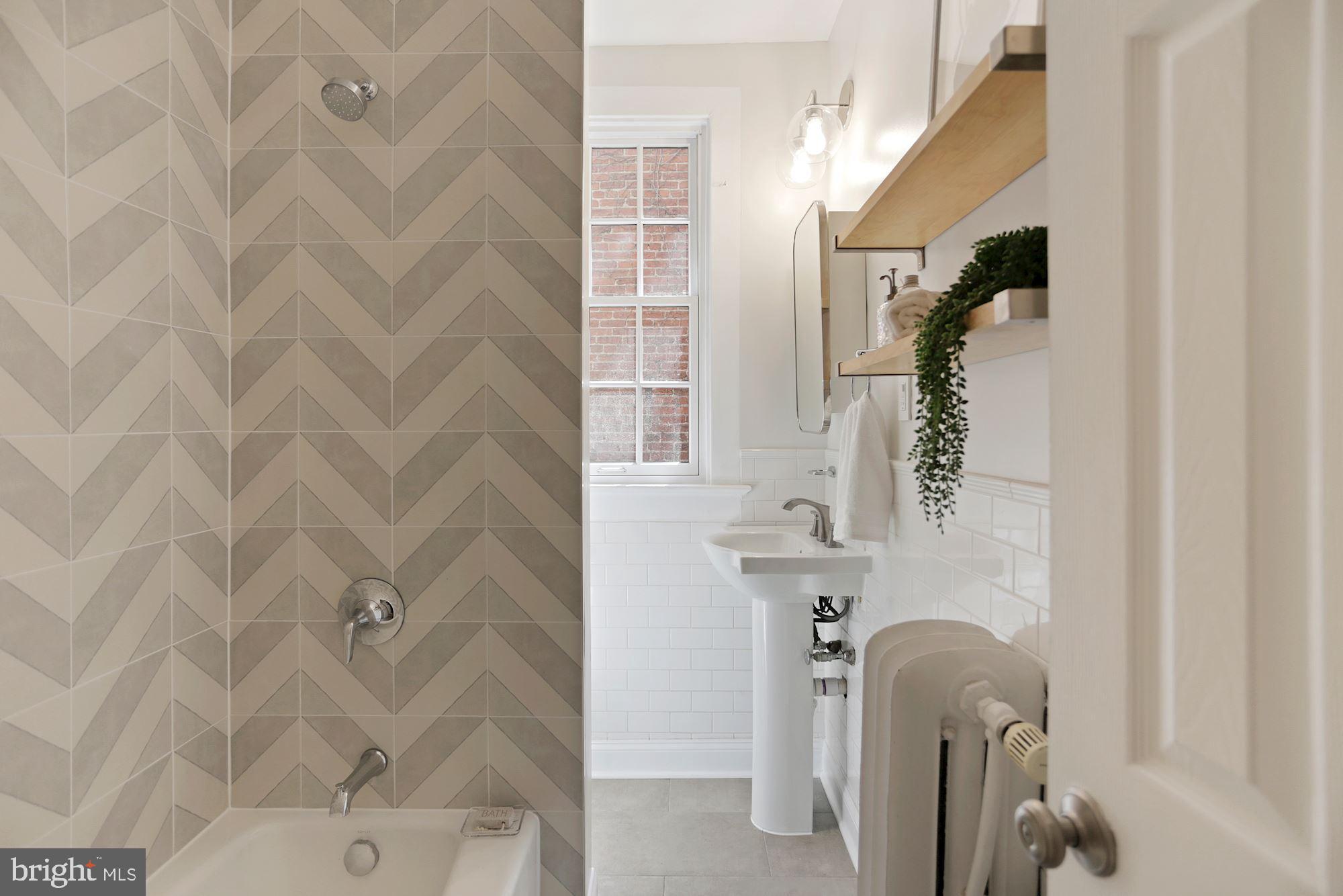 1705 Lanier Place Northwest, Unit 304 Washington, DC 20009 - Photo 20 of 35 Renovated Bath w New Tub, Tile, Sink & Fixtures