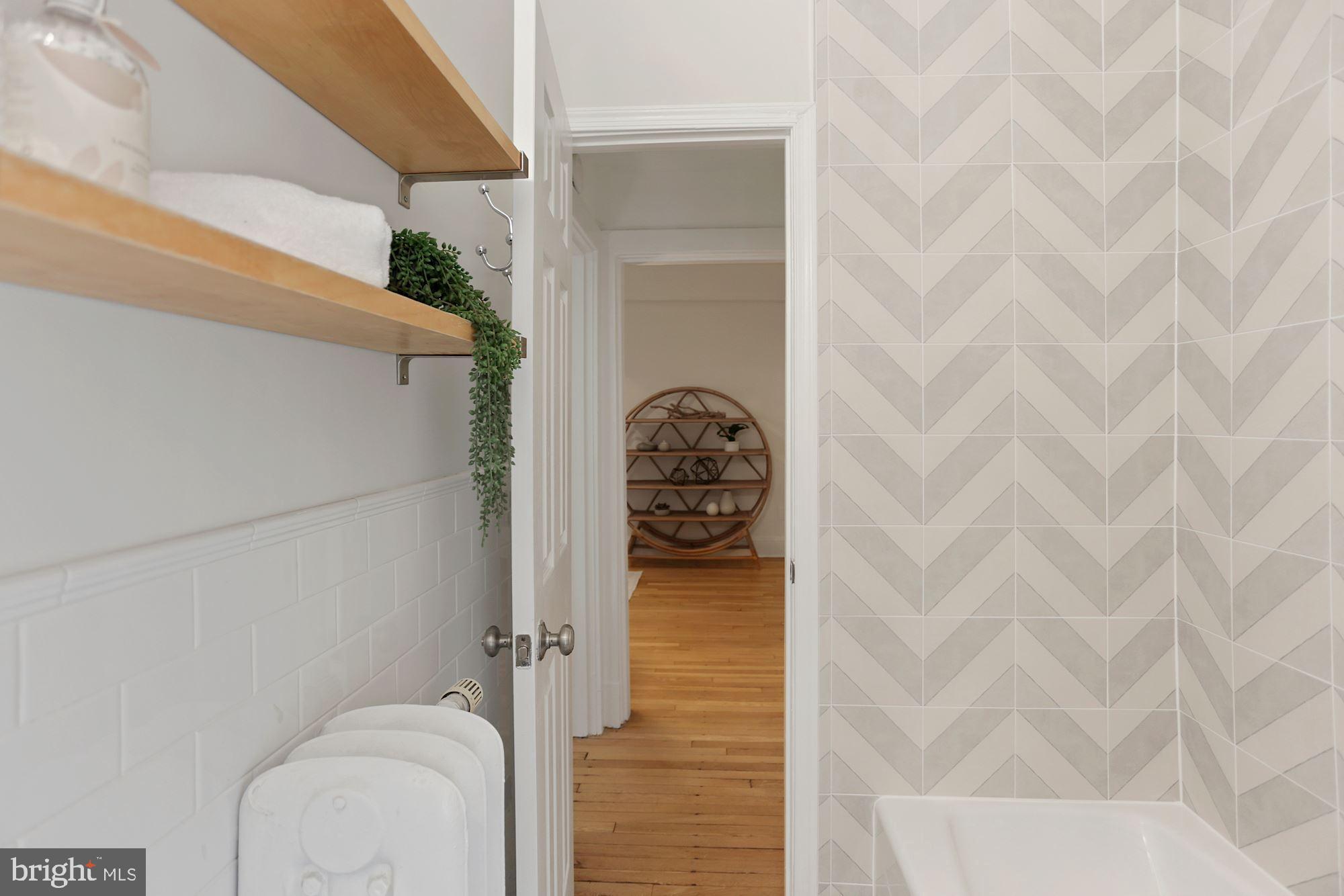 1705 Lanier Place Northwest, Unit 304 Washington, DC 20009 - Photo 21 of 35 Renovated Bath w New Tub, Tile, Sink & Fixtures