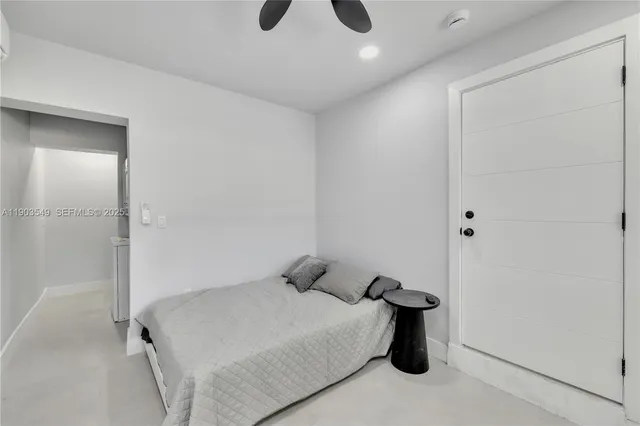 a bedroom with a bed and a shower