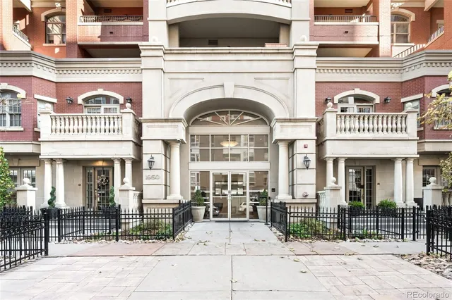 a view of a brick building with many windows