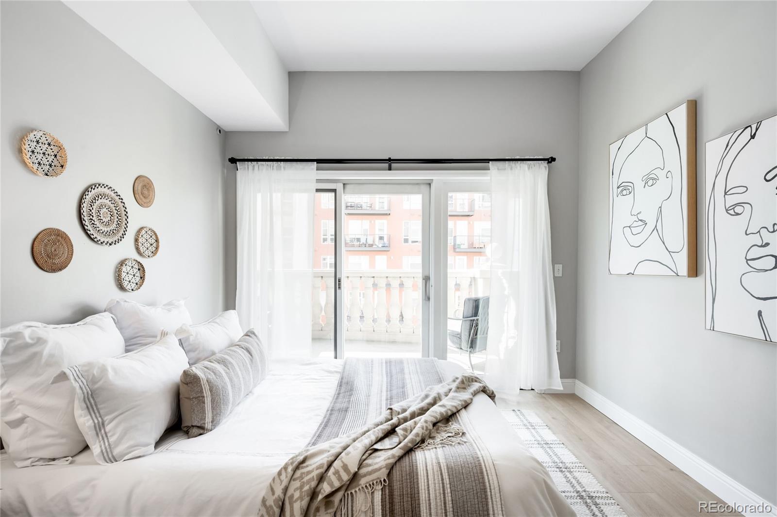 1950 Logan Street, Unit 901 Denver, CO 80203 - Photo 11 of 24 a bedroom with a bed and a window