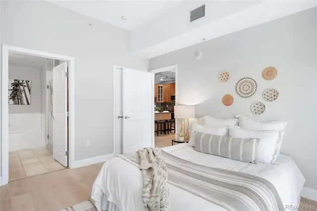 a bed room with a bed and a table