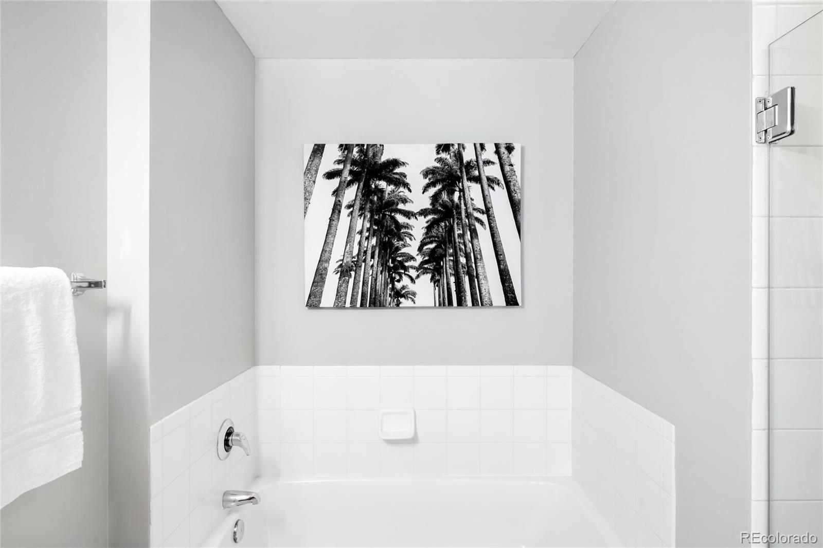 1950 Logan Street, Unit 901 Denver, CO 80203 - Photo 14 of 24 a bathroom with a bathtub and a shower