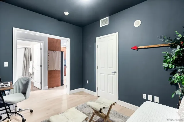 a bedroom with a bed and furniture