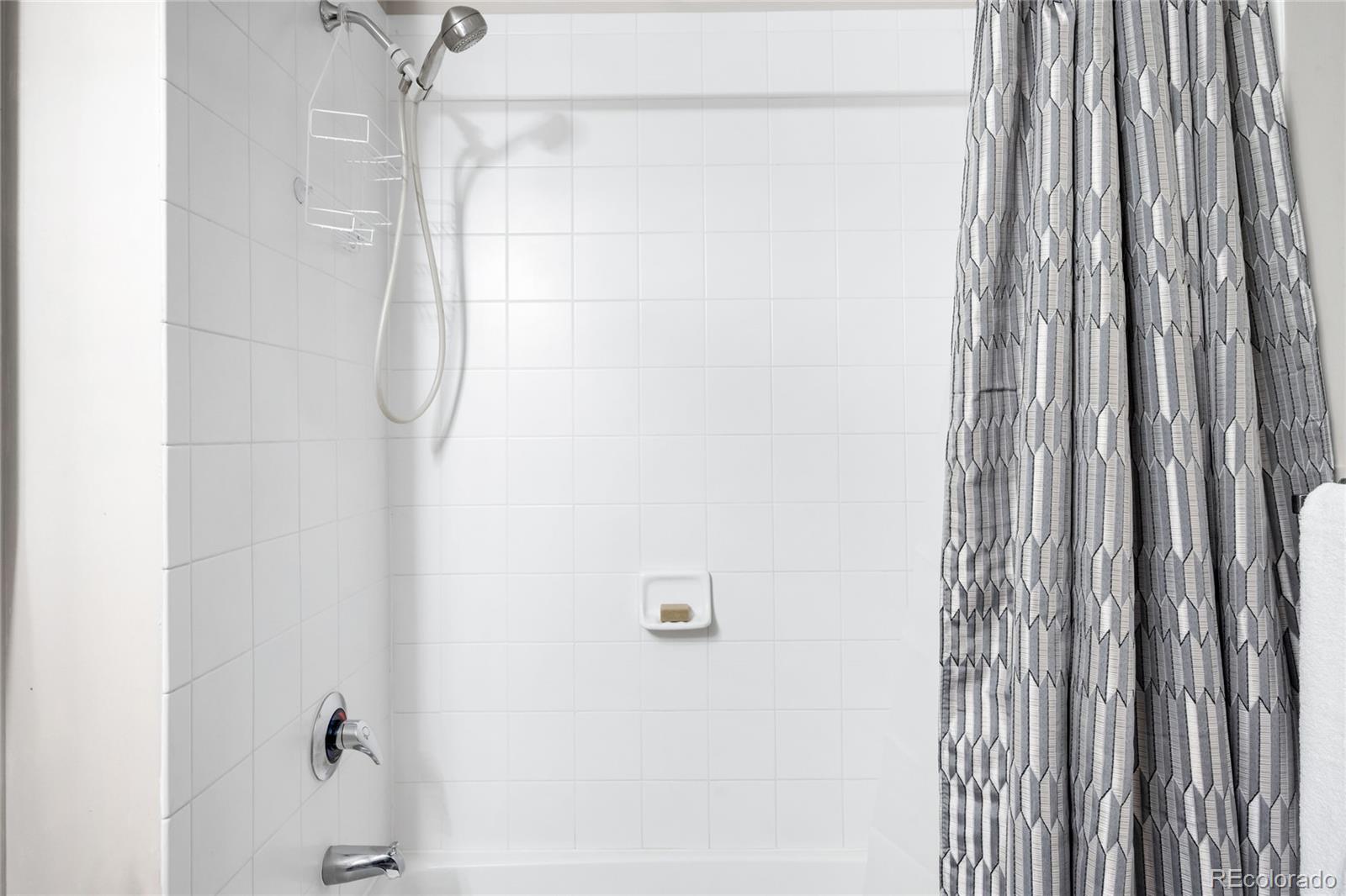 1950 Logan Street, Unit 901 Denver, CO 80203 - Photo 20 of 24 a bathroom with a shower